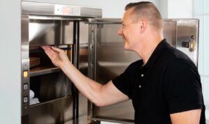 Man opening dumbwaiter