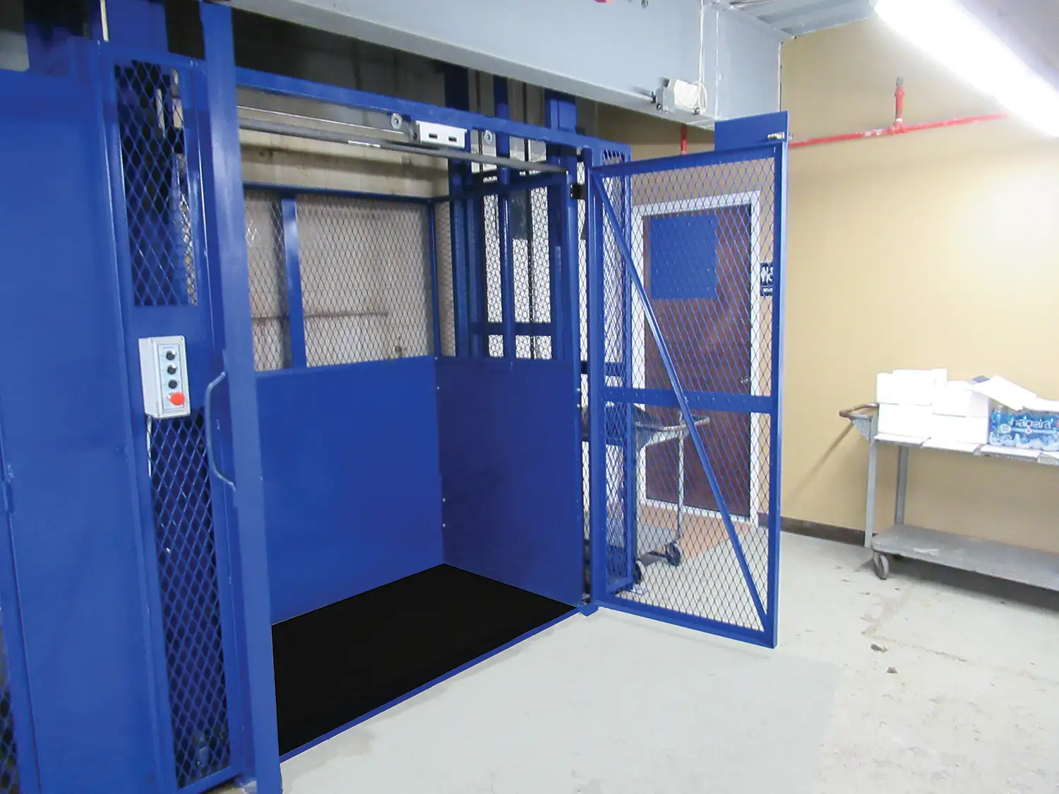 Symmetry blue material lift with the gates open